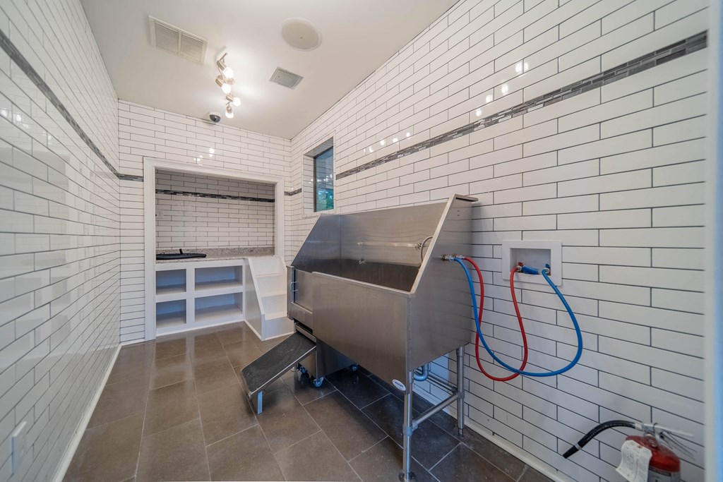 a bath room with a bath tub and a sink